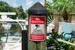 © Jason - No Trespassing sign on a wood dock post with cap cover at Miami, Florida