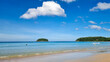 Kata beach Phuket Thailand on a sunny day with a blue sky