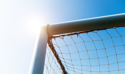 Wall Mural - Soccer goal against blue sky