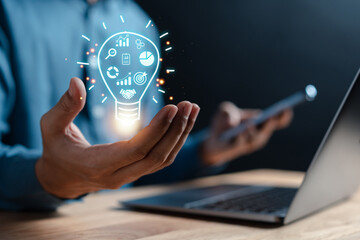 Fototapete - Businessman showing light bulb with business target planning development leadership and customer target group, investment growth and success development, achievement, goal, strategy, finance concept.