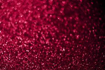 Trendy viva magenta color of the year 2023, pink red hearts, sparkling glitter bokeh background, valentines day abstract defocused texture