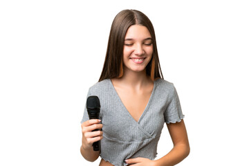 Sticker - Teenager singer girl picking up a microphone over isolated background smiling a lot