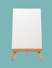 Vertical Empty Blank White Canvas Mockup Standing On Mini Wood Easel Tripod On Gray Blue Background