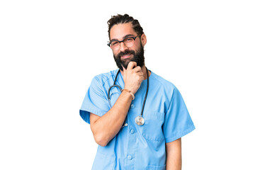 Canvas Print - Young doctor man over isolated chroma key background with glasses and smiling