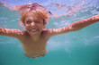© Sergey Novikov - Close-up portrait of a boy swim underwater in ocean open eyes