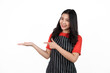 © Phushutter - Palm up hands or showing product, Food shop owner concept, Smiling young confident asian woman in black apron and red t-shirt isolated on white background.