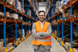 © Dusan Petkovic - A successful small business owner is standing in warehouse and smiling at the camera.
