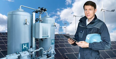 Engineer with tablet computer on a background of Green Hydrogen factory