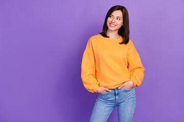 Wall Mural - Photo of sweet pretty lovely girl toothy smile dressed stylish outfit hand pocket look empty space isolated on purple color background