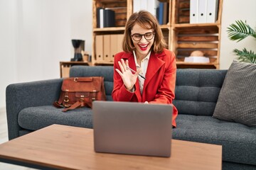 Sticker - Young caucasian woman psychologist having online consultation at psychology center