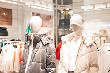 Wall Mural - mannequins on display in a store with clothes in a shopping center