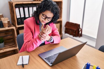 Sticker - Young latin woman business worker suffering for wrist pain at office