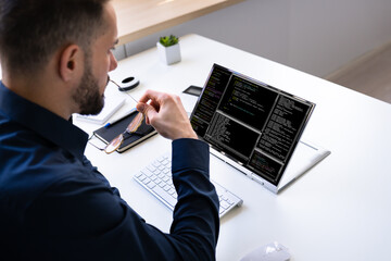Programmer Or Coder At Office Desk