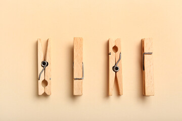 Canvas Print - Wooden clothespins on color background