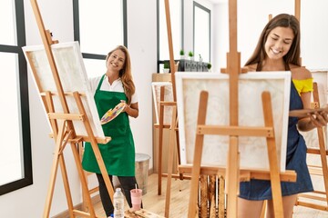 Wall Mural - Mother and daughter smiling confident drawing at art studio