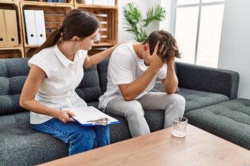 Canvas Print - Man and woman having pshychology session at psychology center