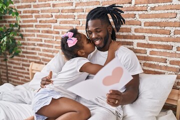 Sticker - Father and daughter sitting on bed reading lovely message at bedroom