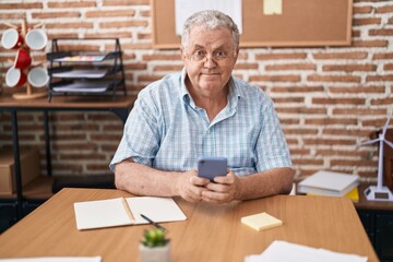 Sticker - Middle age grey-haired man business worker using smartphone working at office