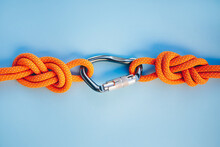 Grey Carbine With Clutch. Equipment For Climbing And Mountaineering. Safety Rope. Knot Eight