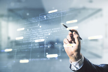 Wall Mural - multi exposure of businessman hand with pen working with abstract graphic coding sketch on blurred o