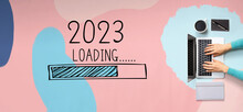 Loading New Year 2023 With Person Using A Laptop Computer