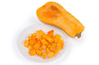 Slices of butternut squash on dish and half of squash