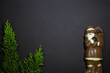Santa Claus made of dark and white chocolate and a Christmas tree on a black background