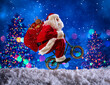 © alphaspirit - Santaclaus wheelie with bike to deliver fast christmas gifts
