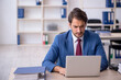 © Elnur - Young male employee and too much work in the office