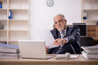 © Elnur - Old male boss employee working in the office