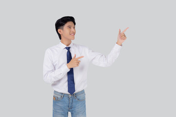 Sticker - Portrait young asian business man pointing and presenting isolated on white background, advertising and marketing, executive and manager, male confident showing success, expression and emotion.