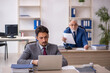 © Elnur - Two male colleagues working in the office