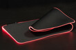 large flexible backlit mouse pad on a dark background