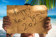 2023 Happy new year travel and lifestyle concept with map and tourist man on tropical island beach. Banner for winter, summer exotic family vacation.
