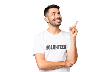 Wall Mural - Young volunteer caucasian man over isolated chroma key background pointing up a great idea