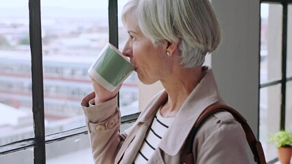 Poster - Business woman, drinking coffee or thinking by window in modern office, advertising studio or marketing agency. Manager, mature ceo or leadership with drink, creative ideas or design innovation goals