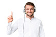 © luismolinero - Telemarketer caucasian man working with a headset over isolated chroma key background showing and lifting a finger in sign of the best