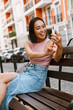 © Drobot Dean - Young beautiful smiling happy asian girl taking selfie on phone