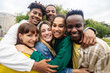 © Xavier Lorenzo - Portrait group of happy young student friends smiling at camera outdoor