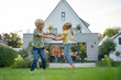 © Westend61 - Happy girl and boy playing in garden