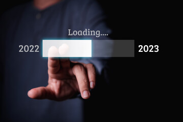 Aufkleber - Male hand pressing on virtual loading screen to year 2023