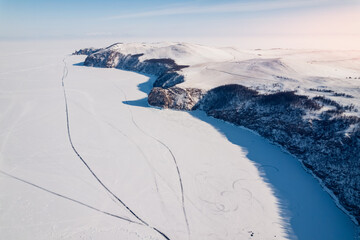 Wall Mural - Winter landscape sunny day blue clear ice on Baikal lake aerial top view