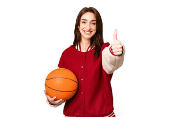 Canvas Print - Young basketball player woman over isolated chroma key background with thumbs up because something good has happened