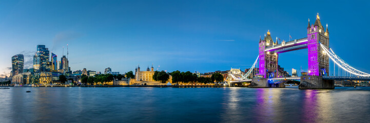 Wall Mural - Panorama  of the City of London, the Thames river and the Tower bridge at night in London, UK