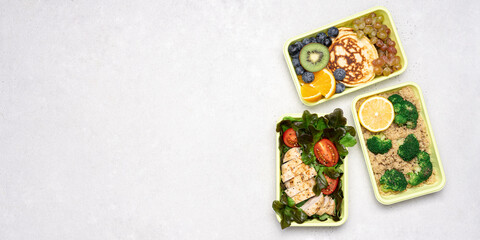 Ready meals for Breakfast, lunch, dinner in green recyclable containers on a white background. Delivery menu, lunch box concept