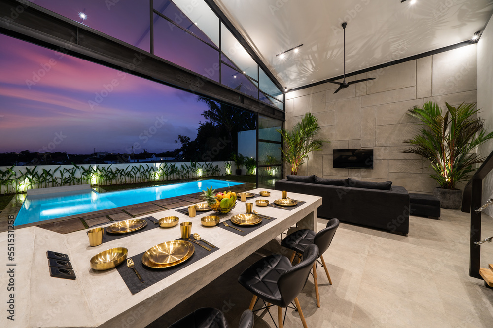 Tropical villa view with garden, swimming pool and open living room at ...
