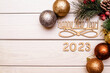 Leinwandbild Motiv Happy new year 2023 on wooden white background
