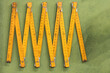 © ADDICTIVE STOCK - Folding ruler on green table