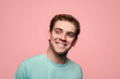 © ADDICTIVE STOCK - Glad young red hair man standing against pink background
