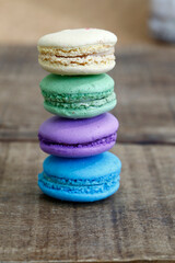 Colorful macarons on rustic wood table